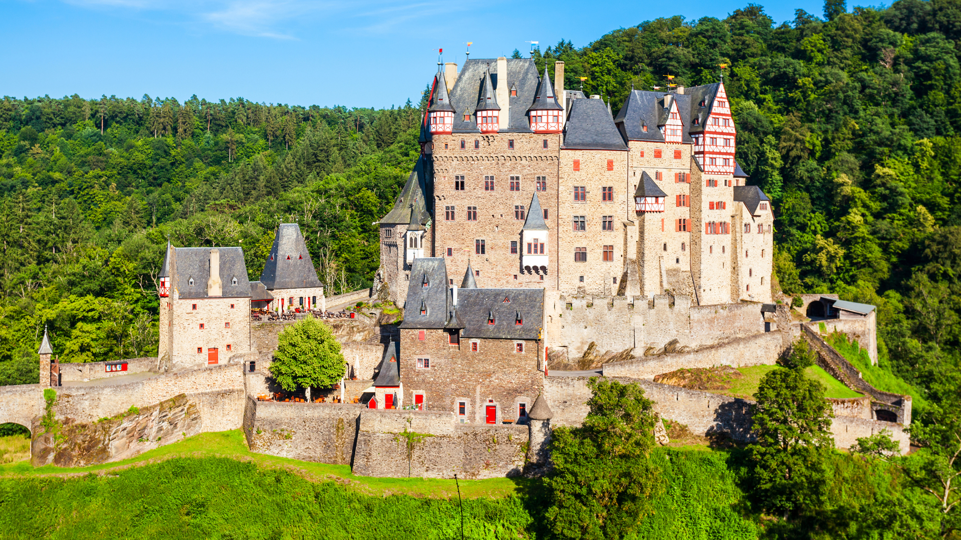 Eltz Castle surrounded by forest in the Moselle region